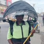 coimbatore-corporation-checks-wearable-umbrella-gear-for-conservancy-staff