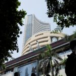 Markets fall in initial trade dragged by Kotak Bank, trade deal ...