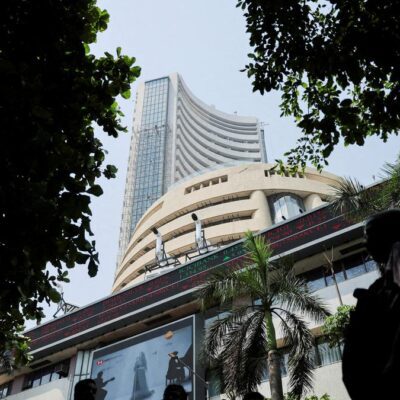 Markets fall in initial trade dragged by Kotak Bank, trade deal ...